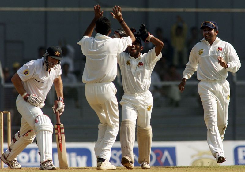 Nilesh Kulkarni rejoicing after picking a wicket.
