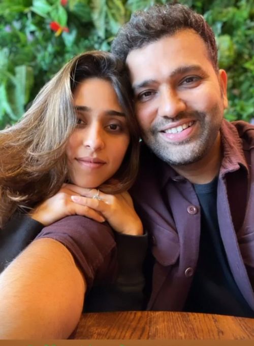 Rohit Sharma poses with his wife.