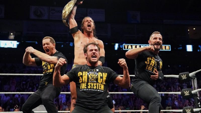 Adam Cole as NXT Champion with The Undisputed Era