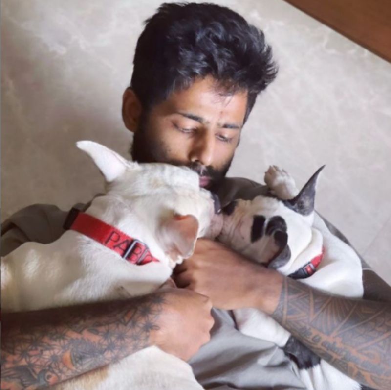 Suryakumar Yadav with his pets Pablo and Oreo. Pic: Suryakumar Yadav/ Twitter