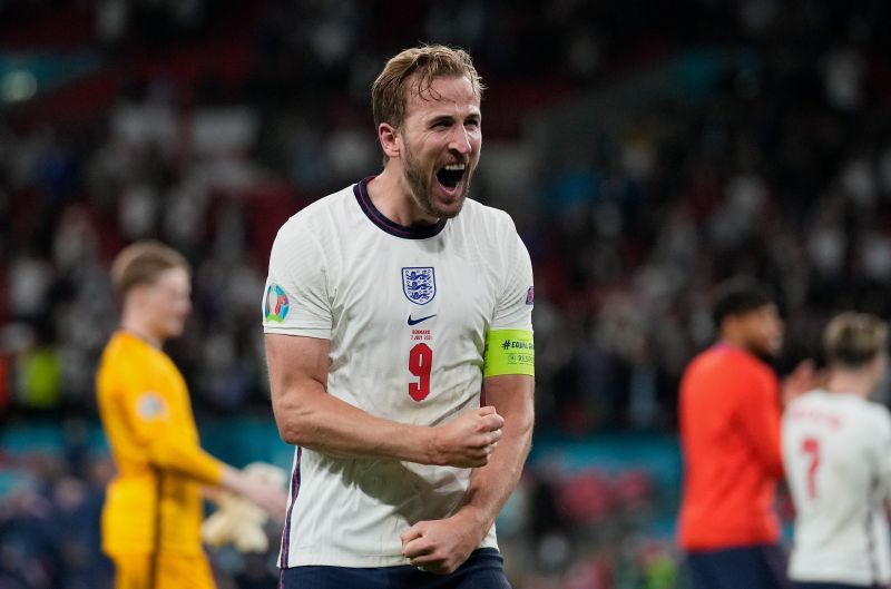 Harry Kane exults after scoring against Denmark