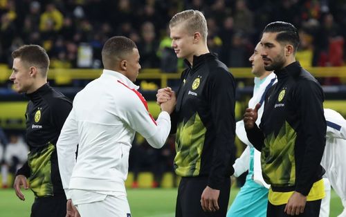 Kylian Mbappe greets Erling Haaland