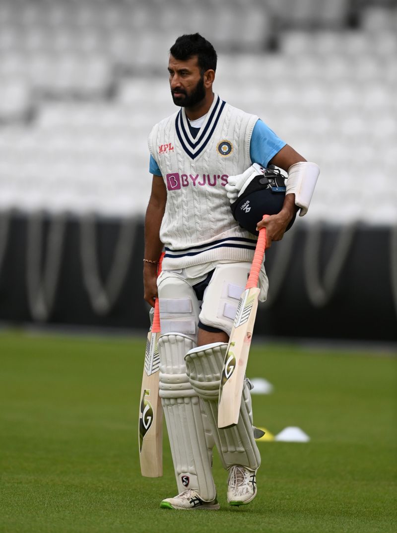 Cheteshwar Pujara walks to the nets for his session.