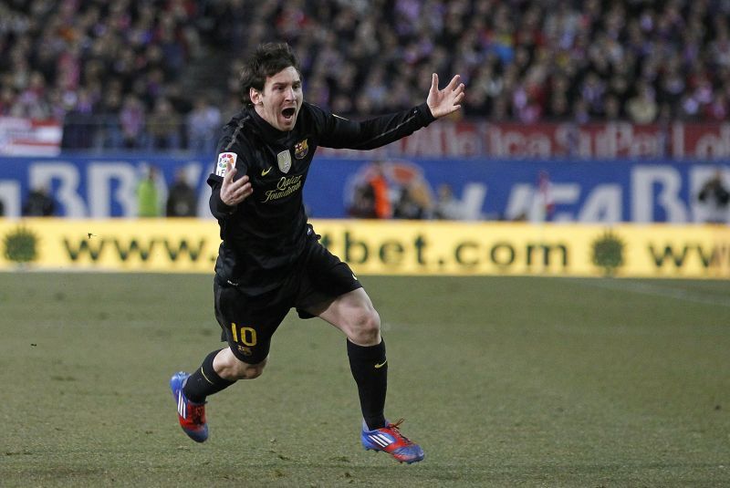 Messi wheeling away in celebration after scoring a brilliant free-kick against Atletico Madrid