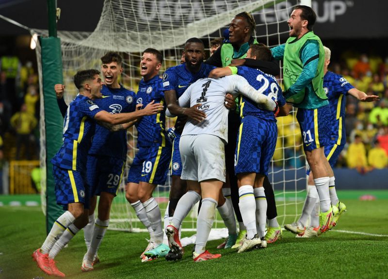 Chelsea players celebrate with Kepa Arrizabalaga as he saves the last penalty.