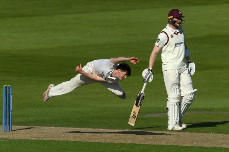 George Garton's unique bowling action in full flow