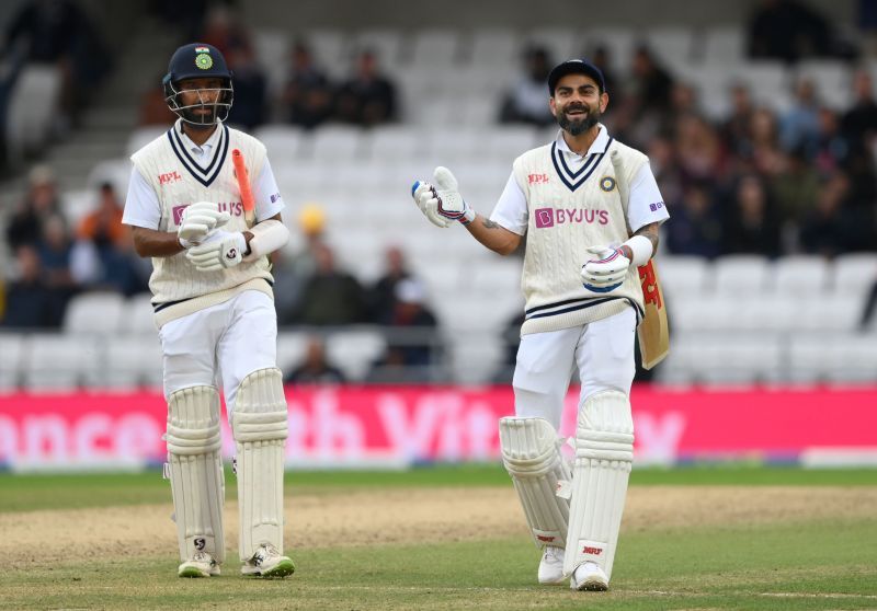 Indian batsmen Virat Kohli (right) and Cheteshwar Pujara leave the field after day three of the Headingley Test. Pic: Getty Images