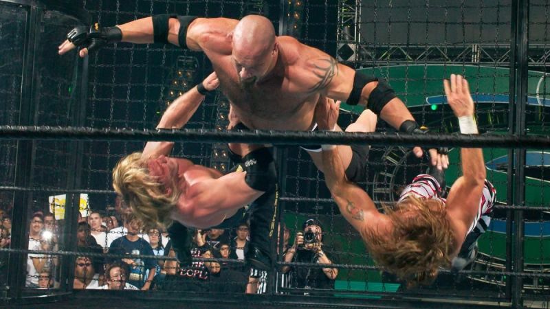 Goldberg taking down Chris Jericho and Shawn Michaels inside the Elimination Chamber