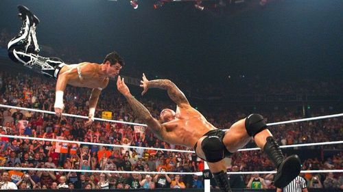 Randy Orton hitting an RKO on Evan Bourne.