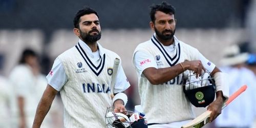 Virat Kohli (L) and Cheteshwar Pujara