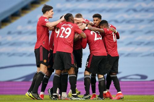 Manchester United players celebrate a previous goal.