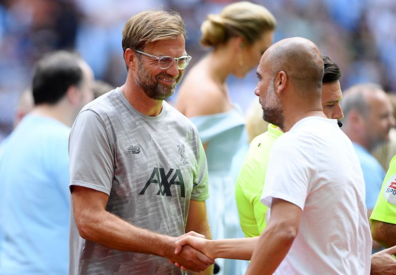 File photo of Liverpool and Manchester City managers. (Photo by Michael Regan/Getty Images)