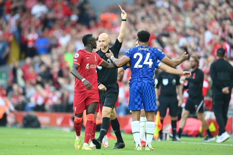 Reece James received a straight red card in the first half for deliberately handling the ball on the line,e