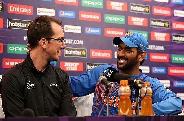 MS Dhoni interacts with a journalist after India's exit from the 2016 T20 World Cup.