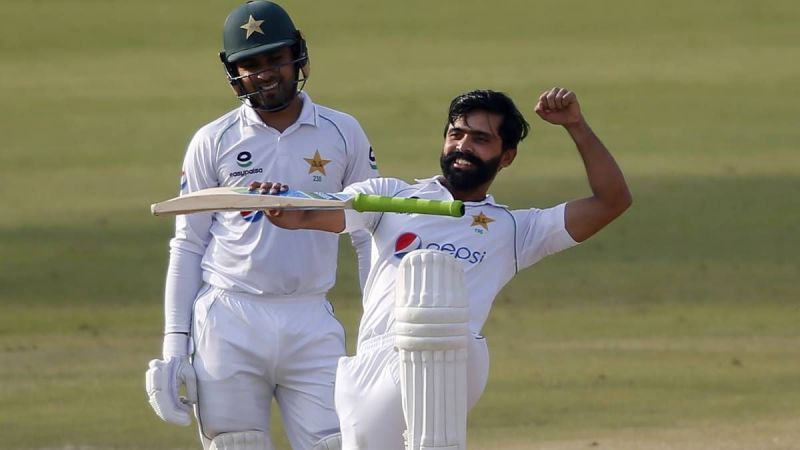 Fawad Alam (R) celebrates after reaching his century