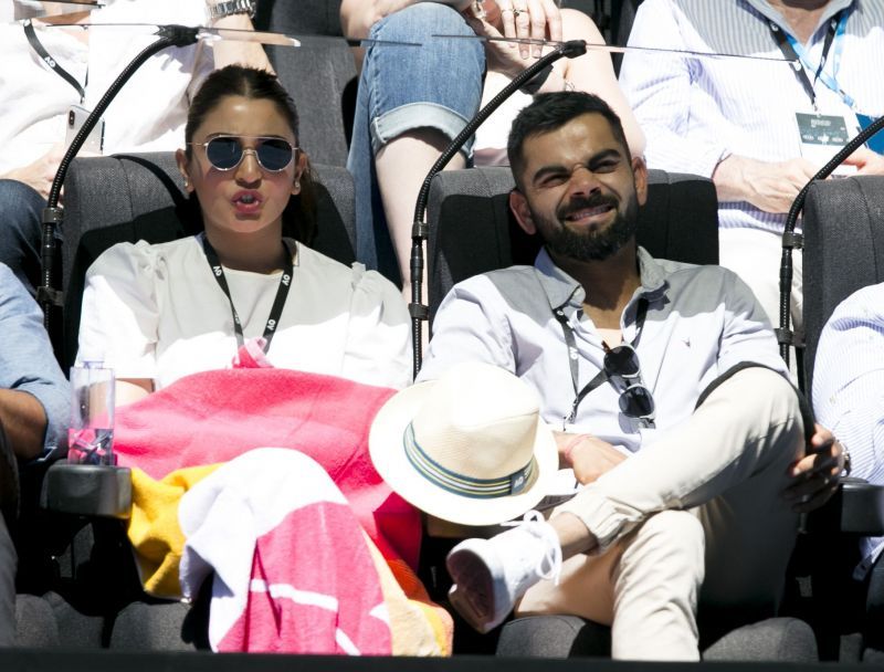Virat Kohli and Anushka Sharma watching a match at the Australian Open in 2019.