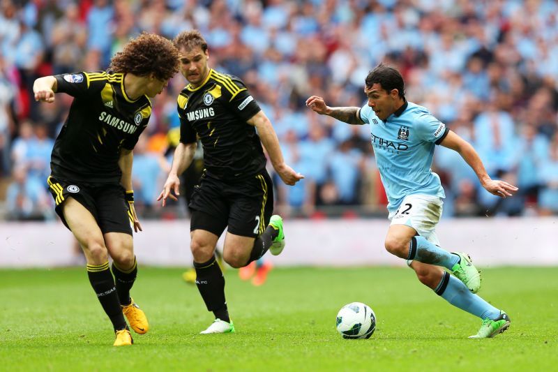 Carlos Tevez (right)