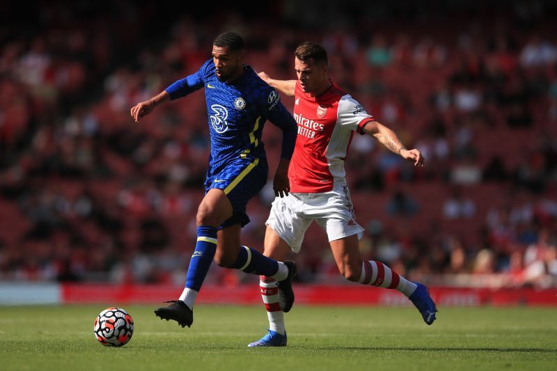 Ruben Loftus-Cheek (left) dribbles past Granit Xhaka