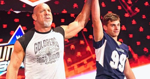 Goldberg with his son, Gage, on RAW.