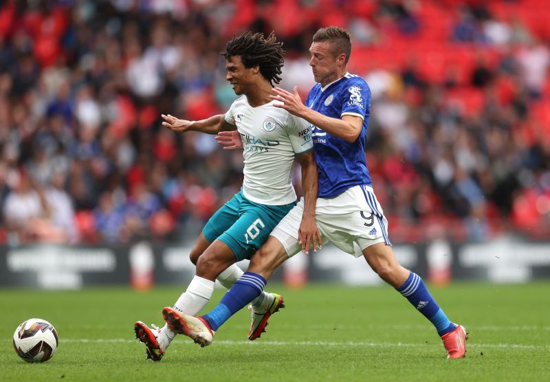 Ake (left) in action for Manchester City