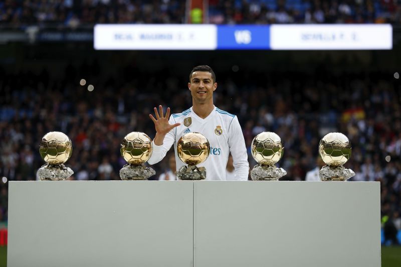 Cristiano Ronaldo poses with his five Ballon d&#039;Or awards