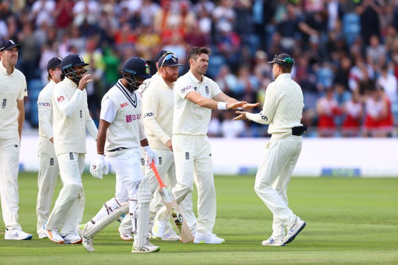 James Anderson celebrates with Joe Root after taking the wicket of Cheteshwar Pujara. Pic: Getty Images