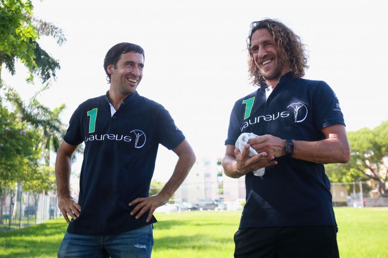 Raul (left) and Carles Puyol
