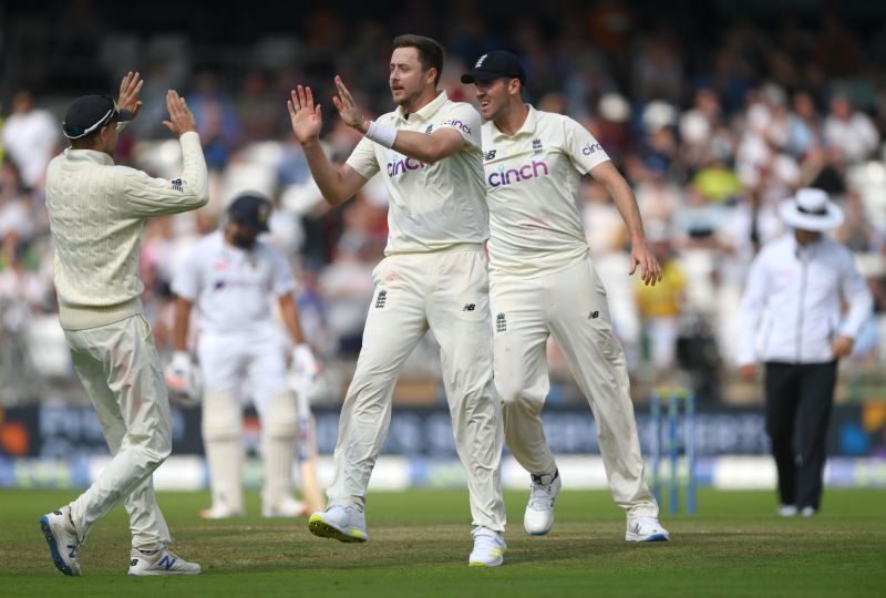 England bowler Ollie Robinson celebrates with teammates after taking the wicket of Rishabh Pant. Pic: Getty Images