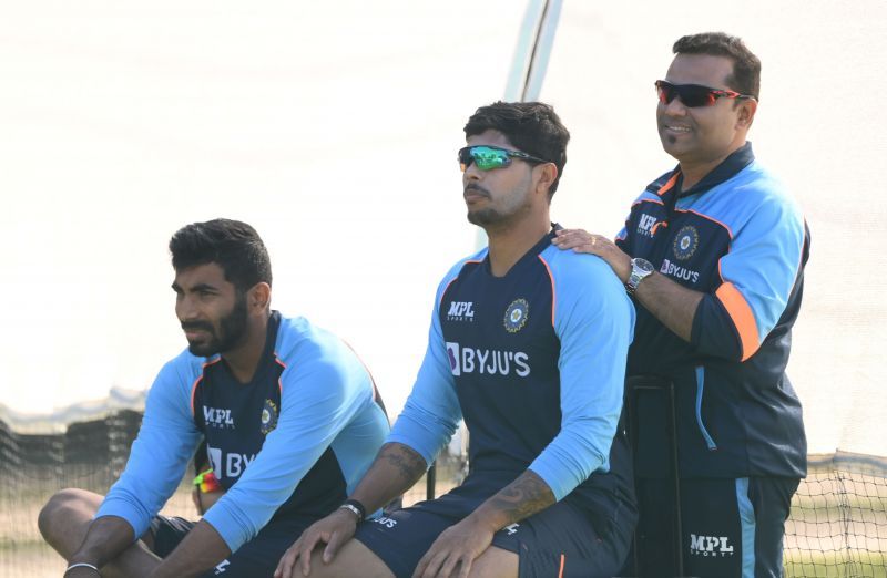 Jasprit Bumrah and Umesh Yadav along with a member of the support staff.