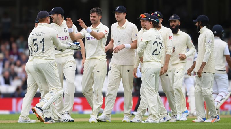 Jimmy Anderson of England celebrates with Jonny Bairstow and teammates after dismissing Cheteshwar Pujara. Pic: Getty Images