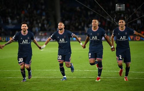 (L to R) Paris Saint-Germain's Lionel Messi, Neymar, Kylian Mbappe and Achraf Hakimi celebrate after defeating Manchester City 2-0 in the UEFA Champions League.