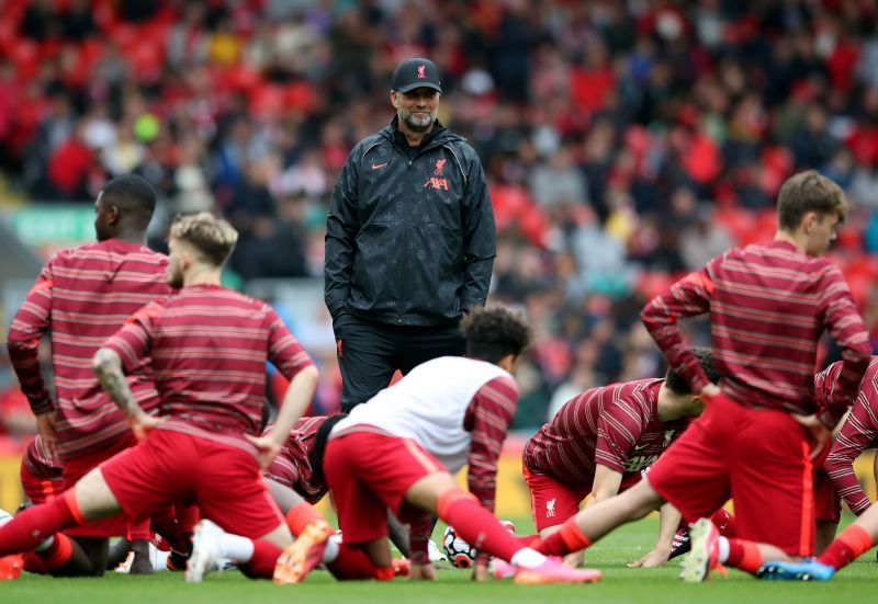 Jurgen Klopp (centre) looks on as Liverpool players warm up ahead of a pre-season friendly.