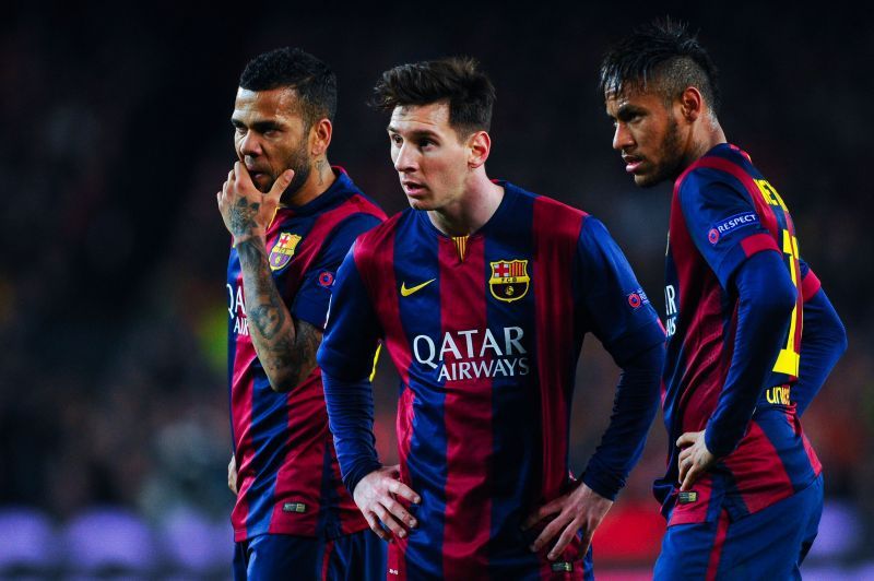 Messi (center) and Alves (left) have won plenty of trophies in their careers