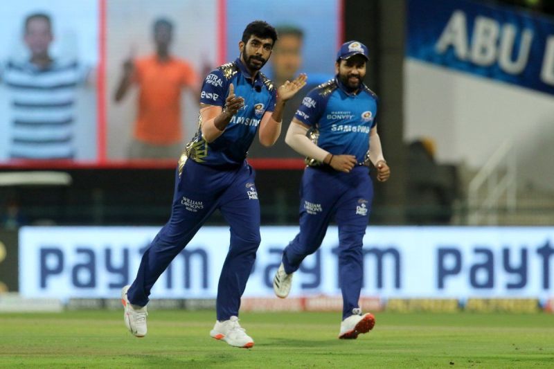 Mumbai Indians&#039; Jasprit Bumrah and Rohit Sharma (R).