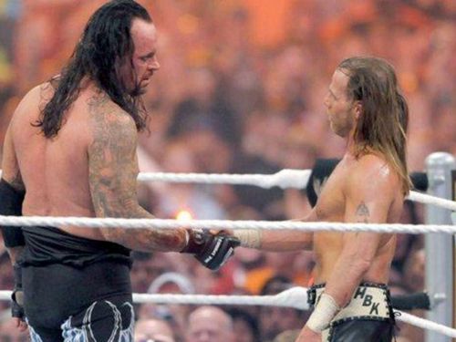 Shawn Michaels and The Undertaker shake hands after an epic battle