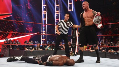 Randy Orton holding up the Universal Championship above Bobby Lashley on RAW