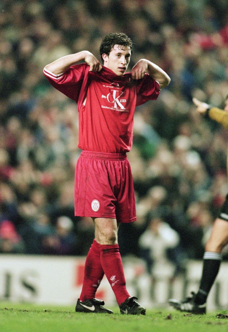 Robbie Fowler showing his support to the sacked dockworkers in a European game