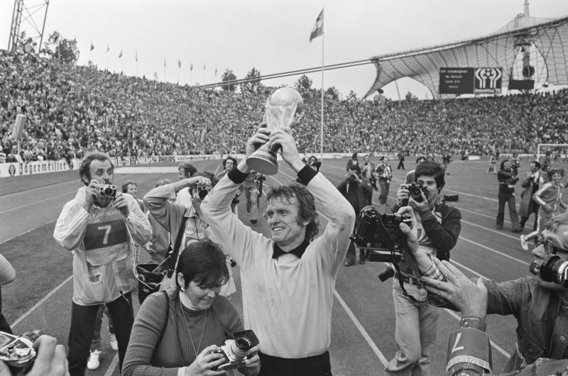 A jubilant Sepp Maier holds the World Cup trophy aloft after West Germany&#039;s remarkable World Cup victory in 1974