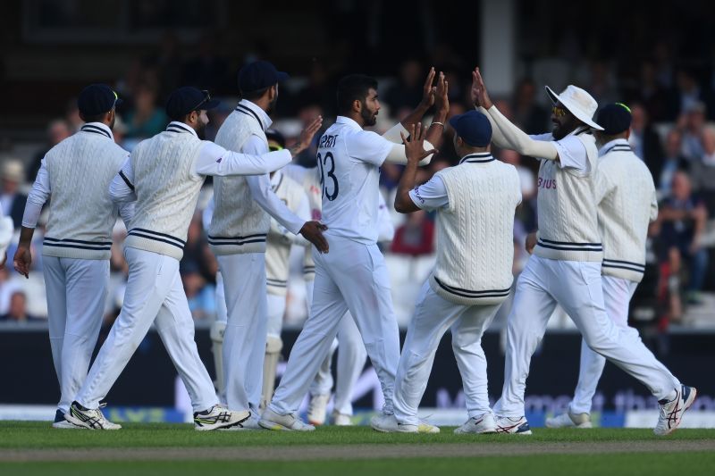 The Indian team celebrates as Jasprit Bumrah dismisses Haseeb Hameed.