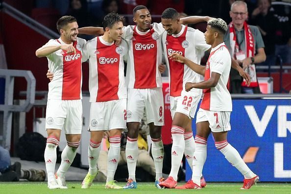 AFC Ajax players celebrate during a match.