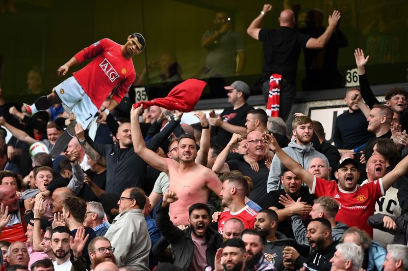 Manchester United fans celebrate during their Premier League encounter with Wolves.
