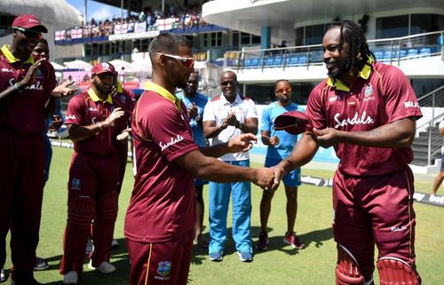 Nicholas Pooran (left) with Chris Gayle.