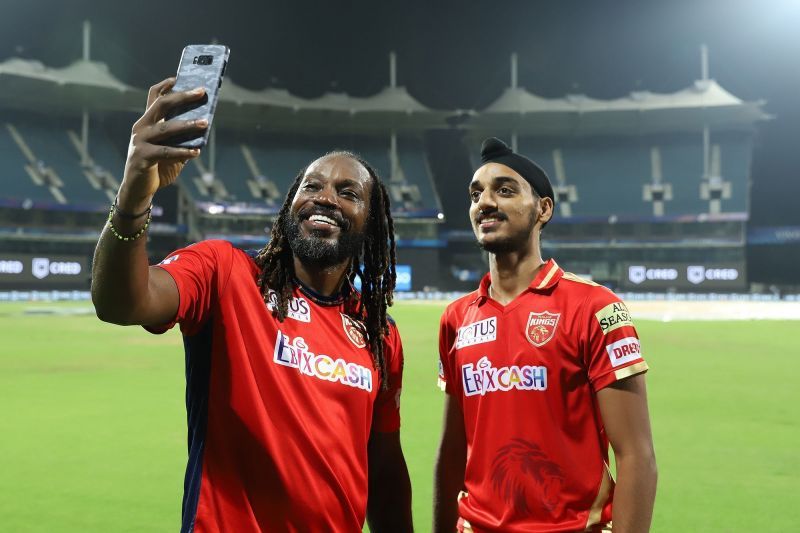 Gayle busy taking a selfie with his teammate