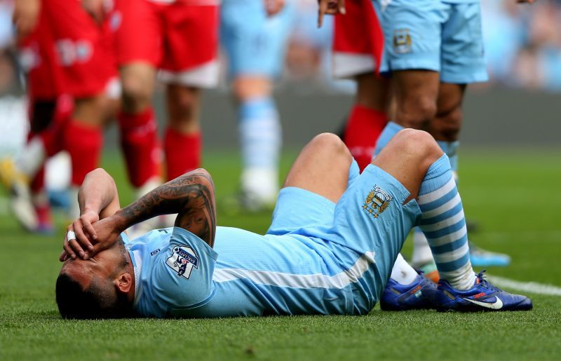 Carlos Tevez after being fouled by Joel Barton - Manchester City v Queens Park Rangers