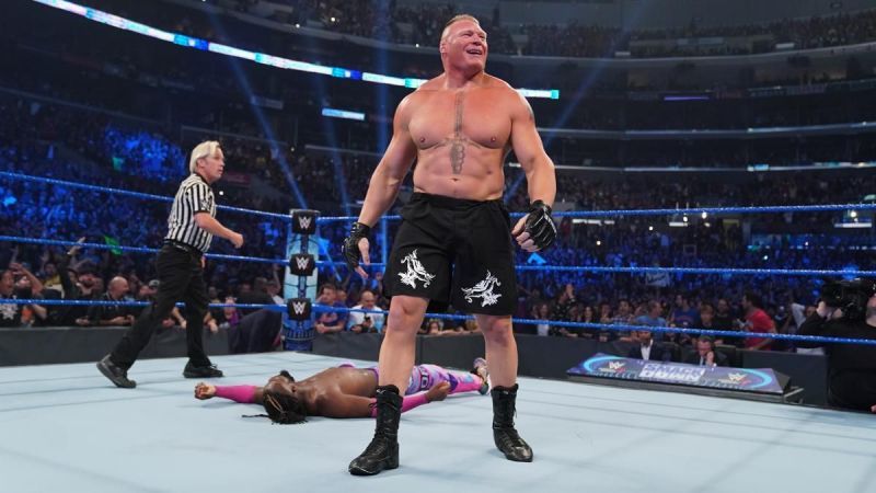 Brock Lesnar standing over Kofi Kingston after a hard-fought ten second match for the WWE Championship