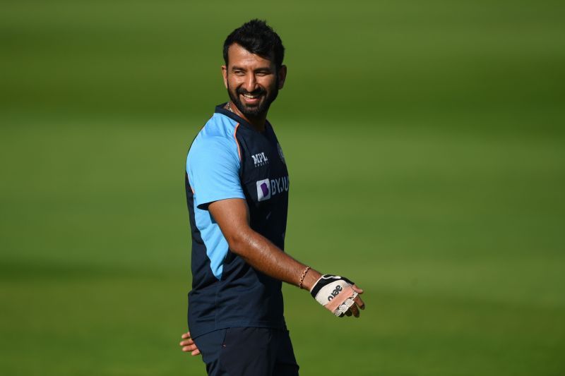 Cheeteshwarr Pujara sports a smile during the practice session.
