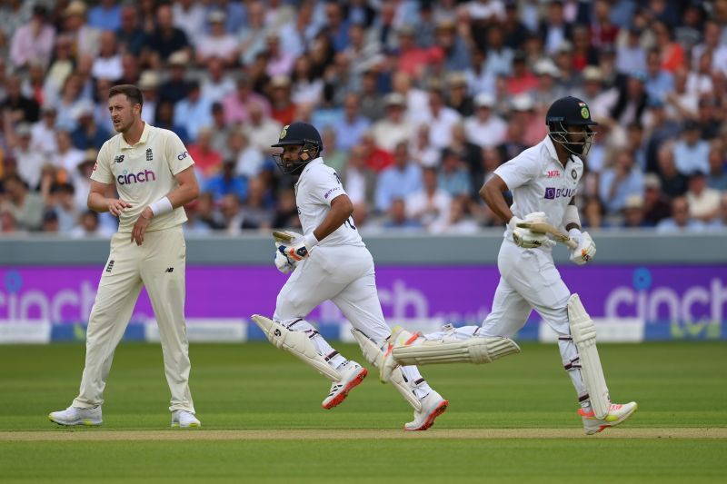 Rohit Sharma (L) and KL Rahul of India run a single as Ollie Robinson of England looks on Day 2 of The Oval Test. Pic: Getty Images