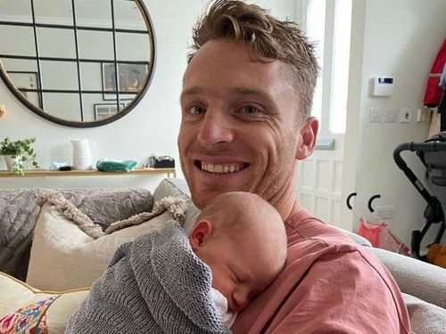 England cricketer Jos Buttler with his newborn, 'Maggie'.