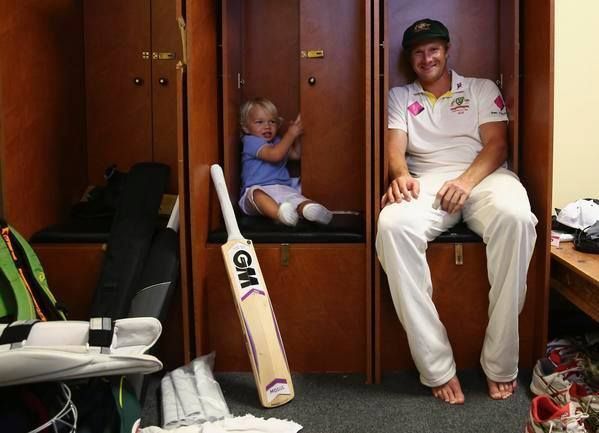 Shane Watson with his son