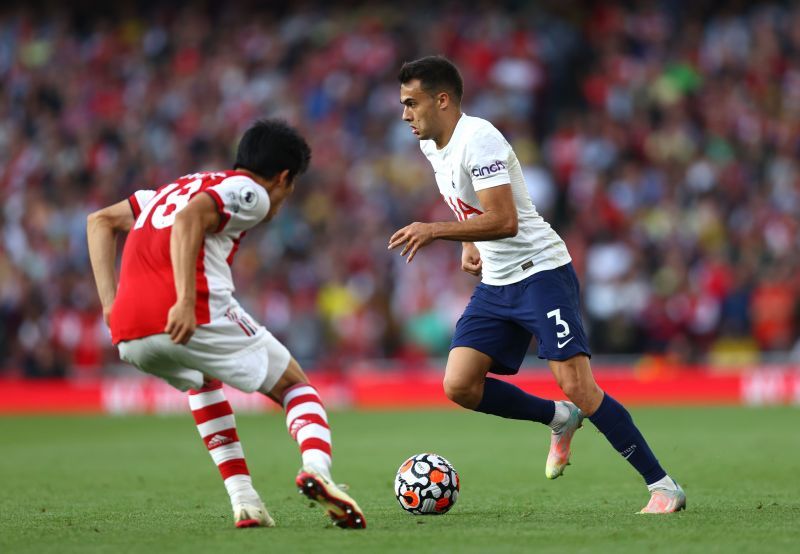 Arsenal defender Takehiro Tomiyasu faces up against Spurs&#039; Sergio Reguilon (right).